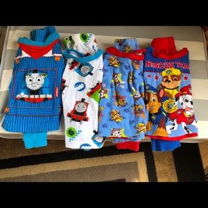 4 pairs of pjs, 2 Thomas and Friends, 2 Paw Patrol